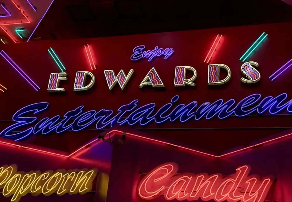 Edwards entertainment signage is glowing in neon lights, illustrating emerging entertainment formats